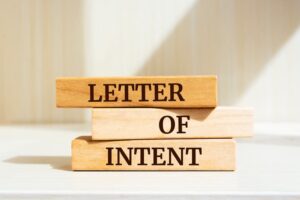 Wooden blocks with words 'Letter of Intent'.